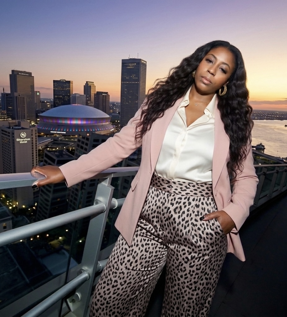 Founder of Geaux Uptown Solutions, New Orleans skyline at sunset